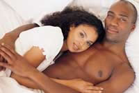 Couples in the bedroom fertility tips with Awakening Fertility